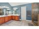 A bathroom featuring double sinks, spacious countertop, and a glass-enclosed shower at 4020 Inman Park Lane, Buford, GA 30519