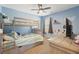 Charming bedroom featuring bunkbeds, a ceiling fan, and bright blue walls for a playful, inviting atmosphere at 4020 Inman Park Lane, Buford, GA 30519
