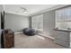 Inviting room featuring neutral carpet, a comfy beanbag, and bright windows, creating a flexible and comfortable space at 4020 Inman Park Lane, Buford, GA 30519
