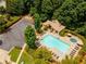 A beautiful community pool and amenity center with ample seating and lounging areas, surrounded by mature trees at 4020 Inman Park Lane, Buford, GA 30519