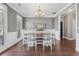 Elegant dining area with hardwood floors, natural light, and stylish chandelier at 4020 Inman Park Lane, Buford, GA 30519