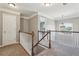 Upstairs hallway with carpet, white railings and trim at 4020 Inman Park Lane, Buford, GA 30519