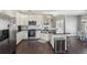 Modern kitchen featuring stainless steel appliances, black countertops, and a large island at 4020 Inman Park Lane, Buford, GA 30519