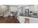 Kitchen with center island featuring white cabinets, stainless steel appliances, and lots of counter space at 4020 Inman Park Lane, Buford, GA 30519