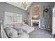 Bright living room featuring a brick fireplace, high ceilings, and an expansive sectional sofa at 4020 Inman Park Lane, Buford, GA 30519