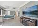 Large main bedroom boasting a tray ceiling, plush carpet, and an entertainment center with a fireplace, providing comfort at 4020 Inman Park Lane, Buford, GA 30519