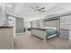 Expansive main bedroom featuring tray ceilings, neutral carpet, and a king bed, providing ample space and luxury at 4020 Inman Park Lane, Buford, GA 30519