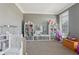 playroom is decorated with grey walls, organizers and a play kitchen at 4020 Inman Park Lane, Buford, GA 30519