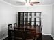 Traditional dining room with a wooden table, chairs, and a decorative ceiling fan at 811 Heritage Valley Rd, Norcross, GA 30093
