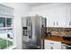 Modern kitchen with stainless steel appliances and adjacent bright window at 811 Heritage Valley Rd, Norcross, GA 30093