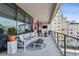 Expansive balcony with stylish seating, a fireplace, and panoramic views of the surrounding neighborhood at 2520 Peachtree Rd # 602, Atlanta, GA 30305