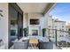 Outdoor seating area on balcony featuring fireplace and city views at 2520 Peachtree Rd # 602, Atlanta, GA 30305