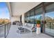 Spacious balcony featuring outdoor kitchen, dining, and lounge areas with city views at 2520 Peachtree Rd # 602, Atlanta, GA 30305