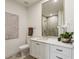 Elegant bathroom featuring a quartz countertop vanity with a large mirror and walk-in shower at 2520 Peachtree Rd # 602, Atlanta, GA 30305