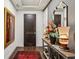 Elegant entryway with hardwood floors, stylish decor, and a decorative mirror at 2520 Peachtree Rd # 602, Atlanta, GA 30305