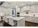 Bright kitchen with a large center island, stainless steel appliances, and modern pendant lighting at 2520 Peachtree Rd # 602, Atlanta, GA 30305