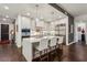 Modern kitchen with stainless appliances, counter seating and hardwood floors open to other living areas at 2520 Peachtree Rd # 602, Atlanta, GA 30305