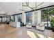 Bright lobby with marble reception desk, light hardwood floors, modern lighting, and large windows at 2520 Peachtree Rd # 602, Atlanta, GA 30305