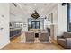 Open-concept living area with hardwood floors, modern decor, and a stone fireplace at 2520 Peachtree Rd # 602, Atlanta, GA 30305