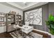 Home office featuring a contemporary desk, built-in shelving, and neutral decor at 2520 Peachtree Rd # 602, Atlanta, GA 30305