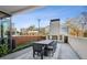 Inviting outdoor patio with a stone fireplace and dining table for entertaining at 2520 Peachtree Rd # 602, Atlanta, GA 30305