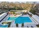 Aerial view of a large outdoor pool with surrounding lounge areas and landscaping at 2520 Peachtree Rd # 602, Atlanta, GA 30305