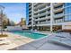 Stunning community pool with sundeck and views of the high-rise building at 2520 Peachtree Rd # 602, Atlanta, GA 30305