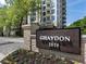 Community sign at Graydon 2520 with manicured landscaping at 2520 Peachtree Rd # 602, Atlanta, GA 30305
