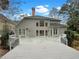 Large back deck with a view of the backyard, featuring a light grey exterior and multiple windows at 3083 Milledge Gate Se Ct, Marietta, GA 30067