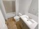 Clean bathroom with a sink vanity, toilet, and tub with shower at 3083 Milledge Gate Se Ct, Marietta, GA 30067