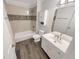 Bathroom featuring decorative tile backsplash, shower, and modern sink vanity at 3083 Milledge Gate Se Ct, Marietta, GA 30067