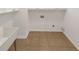 Laundry room with utility sink and tan tile at 3083 Milledge Gate Se Ct, Marietta, GA 30067