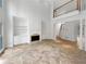 Spacious living room featuring soaring ceilings, custom built-ins, a fireplace, and large tile floors at 3083 Milledge Gate Se Ct, Marietta, GA 30067