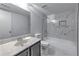 Modern bathroom features updated vanity, toilet and bathtub with tile surround at 748 Garden View Dr, Stone Mountain, GA 30083