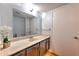 Bathroom with a large vanity, mirror, and ample storage at 748 Garden View Dr, Stone Mountain, GA 30083