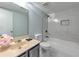 Updated bathroom featuring tub with a tiled shower and stylish fixtures at 748 Garden View Dr, Stone Mountain, GA 30083