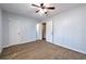 Spacious bedroom with neutral walls, ceiling fan, and carpet at 748 Garden View Dr, Stone Mountain, GA 30083