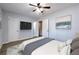 Bedroom with ceiling fan, a mounted TV, and modern decor at 748 Garden View Dr, Stone Mountain, GA 30083