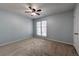 Neutral bedroom featuring natural light and a ceiling fan at 748 Garden View Dr, Stone Mountain, GA 30083