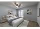Cozy bedroom featuring natural lighting and a ceiling fan at 748 Garden View Dr, Stone Mountain, GA 30083