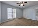 Bright bedroom featuring a ceiling fan and natural lighting at 748 Garden View Dr, Stone Mountain, GA 30083