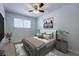 Cozy bedroom with a ceiling fan, window, and comfortable bed at 748 Garden View Dr, Stone Mountain, GA 30083