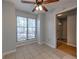 Bright dining area featuring ceramic tile flooring, ceiling fan, and natural light at 748 Garden View Dr, Stone Mountain, GA 30083