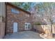 Brick two-story townhome with a white door and fenced backyard at 748 Garden View Dr, Stone Mountain, GA 30083