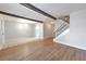 A bright living space with hardwood floors, stairway and an open layout to the kitchen at 748 Garden View Dr, Stone Mountain, GA 30083