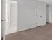 Spacious bedroom featuring neutral carpet and an en suite bathroom with a tiled shower at 219 Holcomb Ferry Rd, Roswell, GA 30076