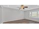 Bedroom featuring wood-look floors, a ceiling fan, and a bright window at 219 Holcomb Ferry Rd, Roswell, GA 30076