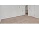Bedroom featuring neutral carpet, white walls, and a closet at 219 Holcomb Ferry Rd, Roswell, GA 30076