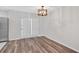 Cozy dining area featuring french doors and modern chandelier at 219 Holcomb Ferry Rd, Roswell, GA 30076