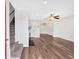 Open living room with modern flooring, fireplace, and a staircase at 219 Holcomb Ferry Rd, Roswell, GA 30076